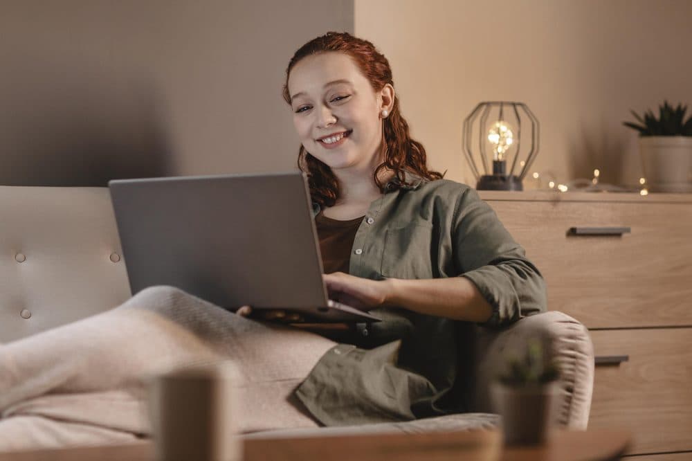 A candidate completing a Kimon skills assessment on a laptop at home